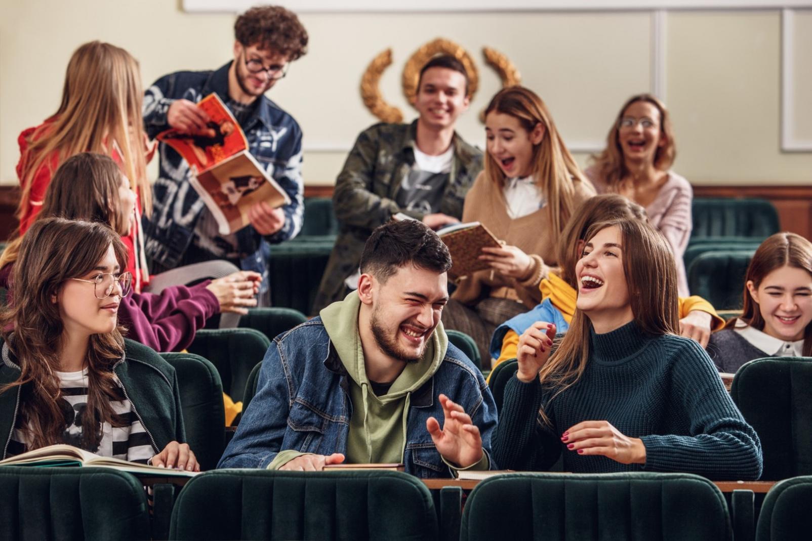 Students working on API testing projects in modern computer lab